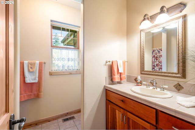 bathroom with vanity and tile patterned floors