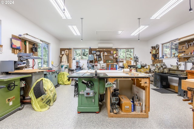 kitchen with a healthy amount of sunlight and a wall unit AC