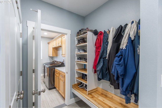 spacious closet featuring washing machine and clothes dryer