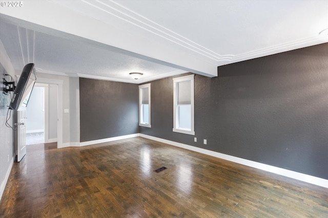 unfurnished room featuring dark hardwood / wood-style flooring and ornamental molding