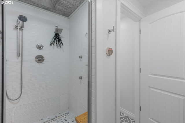 bathroom with tiled shower