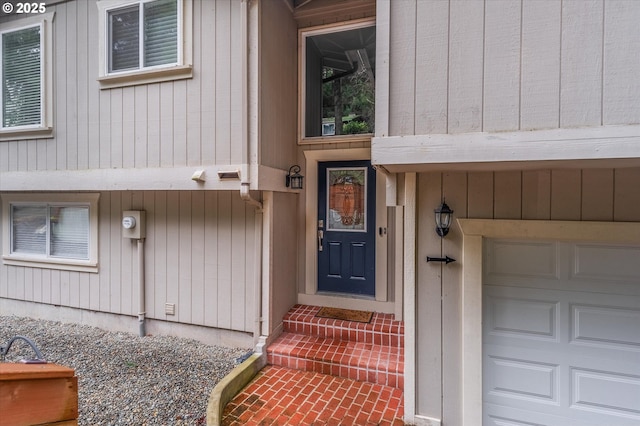 doorway to property featuring a garage