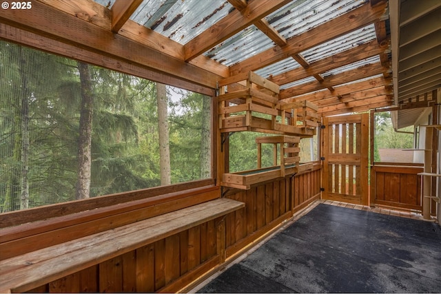 unfurnished sunroom featuring plenty of natural light