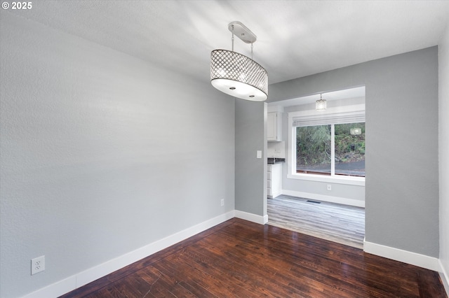 interior space with dark hardwood / wood-style flooring