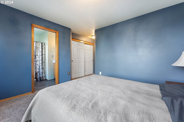 carpeted bedroom featuring a textured ceiling