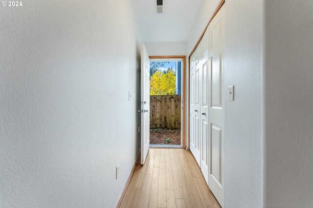 laundry room with light hardwood / wood-style flooring and independent washer and dryer