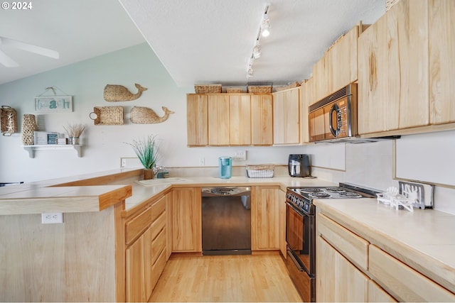 kitchen featuring light brown cabinets and black appliances