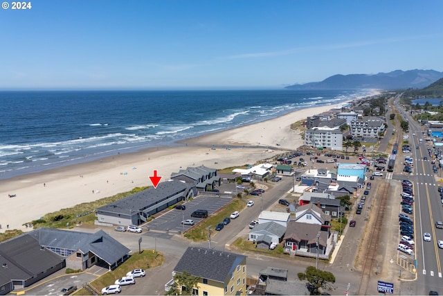 aerial view with a view of the beach and a water view