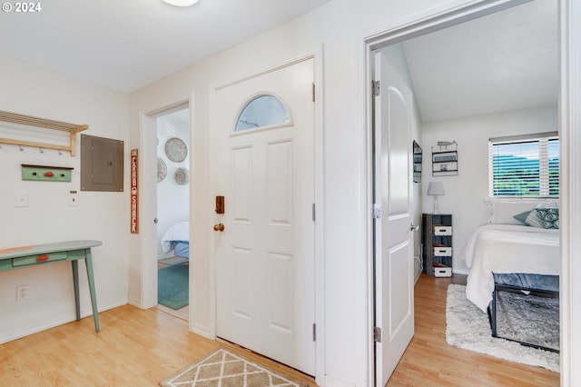 entrance foyer featuring light wood-type flooring and electric panel