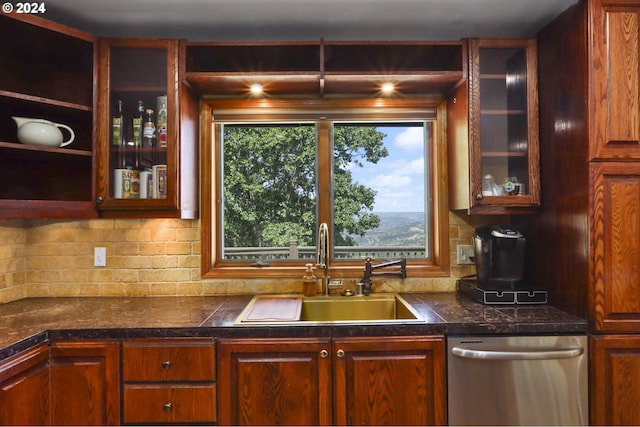 kitchen with stainless steel dishwasher, sink, and tasteful backsplash