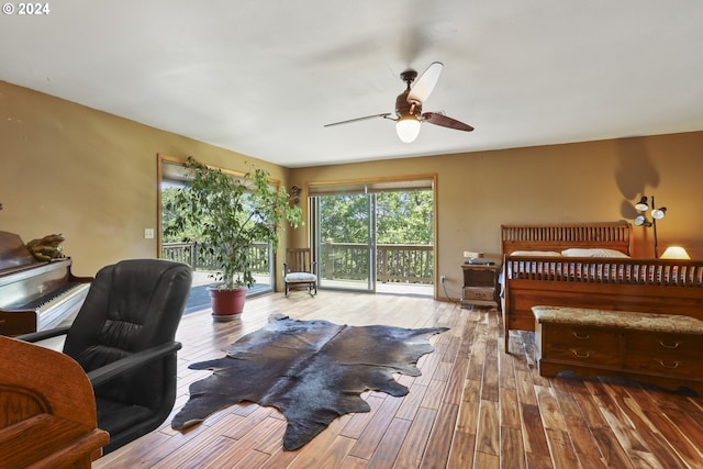 bedroom featuring access to outside, ceiling fan, and hardwood / wood-style floors