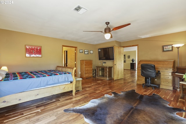 bedroom featuring hardwood / wood-style flooring and ceiling fan