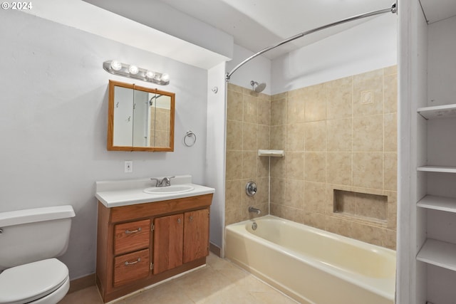 full bathroom with tile patterned flooring, vanity, toilet, and tiled shower / bath