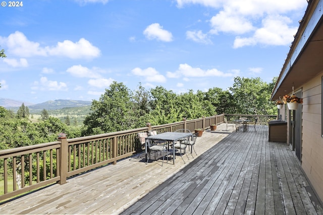 wooden deck with a mountain view