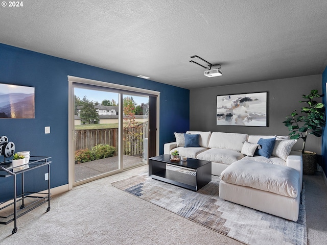 carpeted living room with a textured ceiling