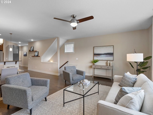 living room with ceiling fan and hardwood / wood-style floors