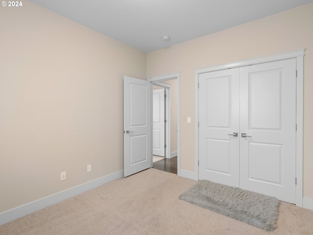 bedroom featuring a closet and carpet