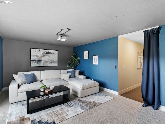 living room with a textured ceiling and carpet floors