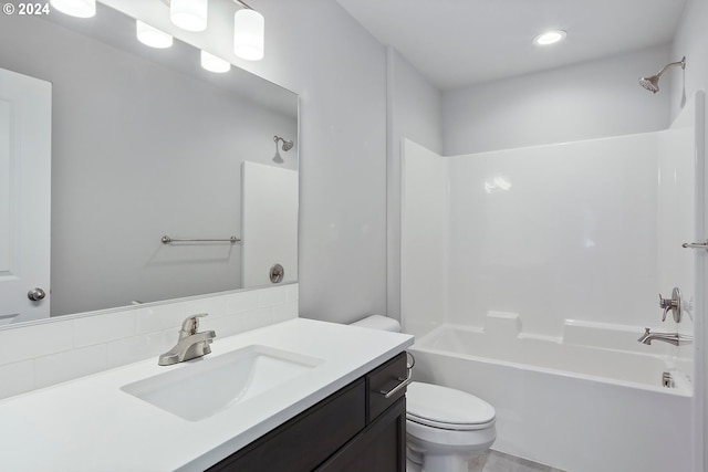 full bathroom with vanity, toilet, shower / bathtub combination, and backsplash