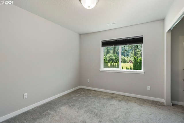 empty room featuring carpet flooring