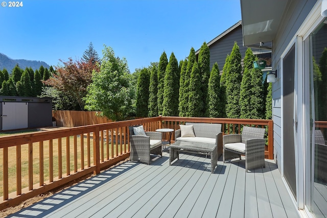 wooden terrace with outdoor lounge area