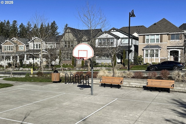 view of basketball court featuring a residential view and community basketball court