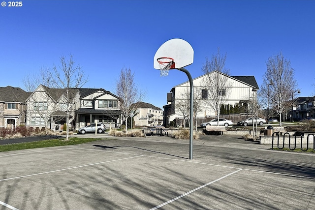 view of sport court with a residential view and community basketball court