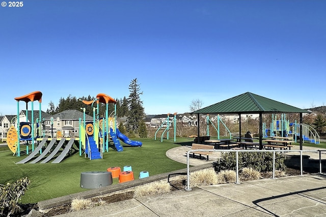 community jungle gym featuring a gazebo and a lawn