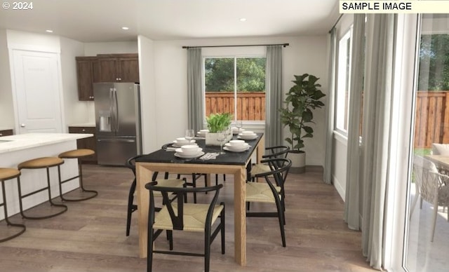 dining space featuring recessed lighting and light wood finished floors