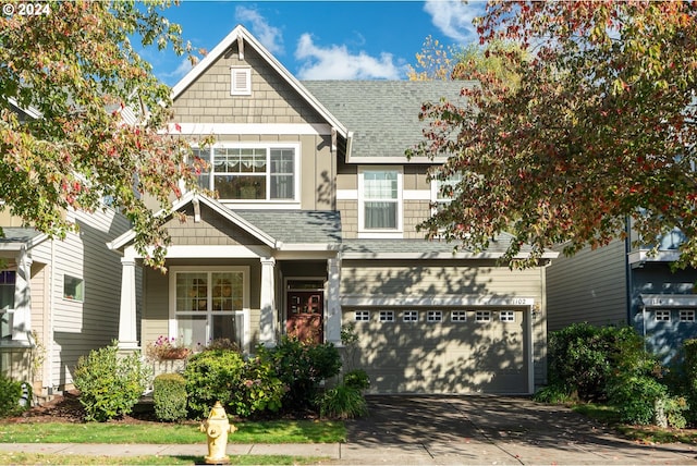 craftsman house with a garage