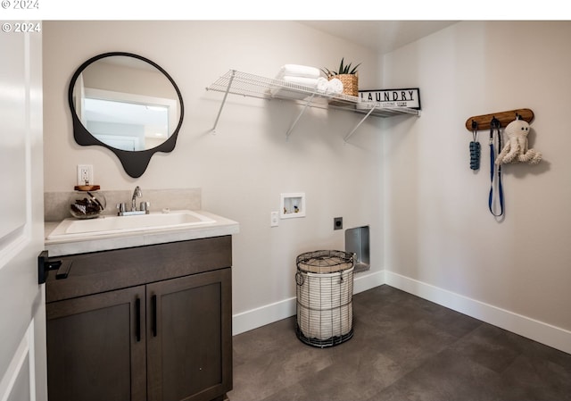 laundry room with hookup for an electric dryer, cabinets, sink, and hookup for a washing machine