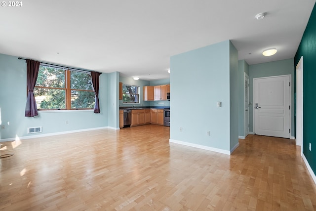 unfurnished living room featuring light hardwood / wood-style flooring