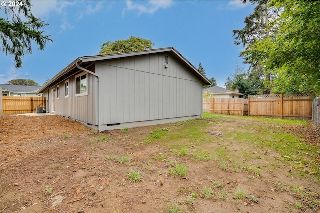 view of side of property with cooling unit