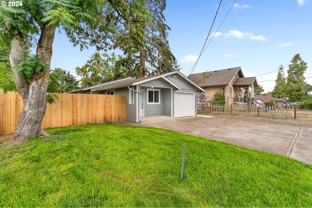 single story home featuring a garage and a front lawn