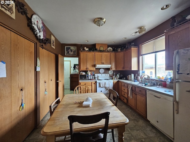 kitchen with white appliances and sink