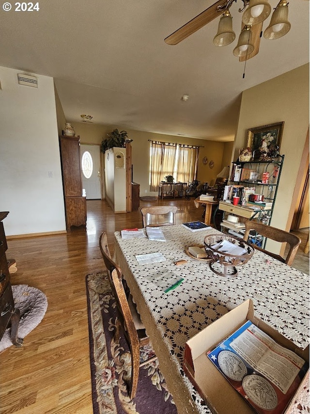 dining space with hardwood / wood-style flooring, plenty of natural light, and ceiling fan