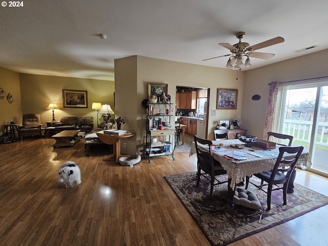 dining room with hardwood / wood-style flooring and ceiling fan