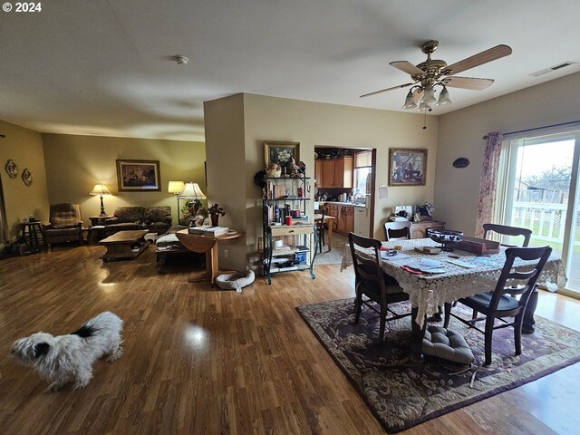 dining space featuring ceiling fan and light wood-type flooring