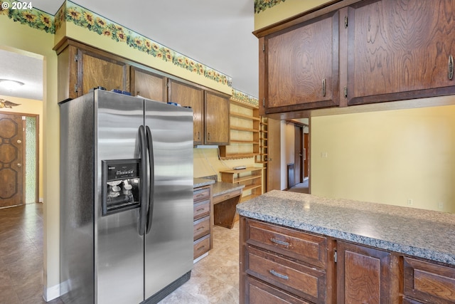 kitchen featuring stainless steel fridge with ice dispenser