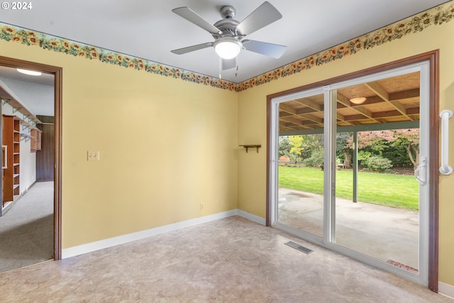 spare room with beam ceiling, coffered ceiling, and ceiling fan