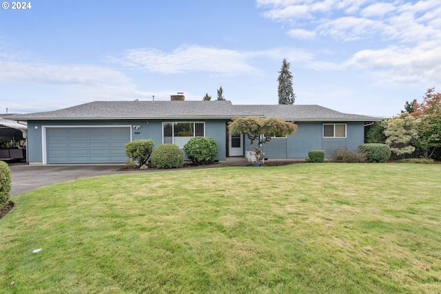 ranch-style home with a front yard and a garage