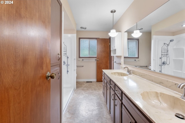 bathroom with vanity, toilet, and walk in shower