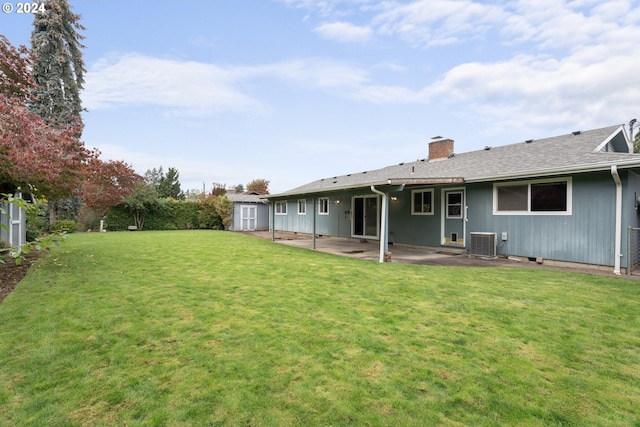 view of yard featuring a patio and central AC