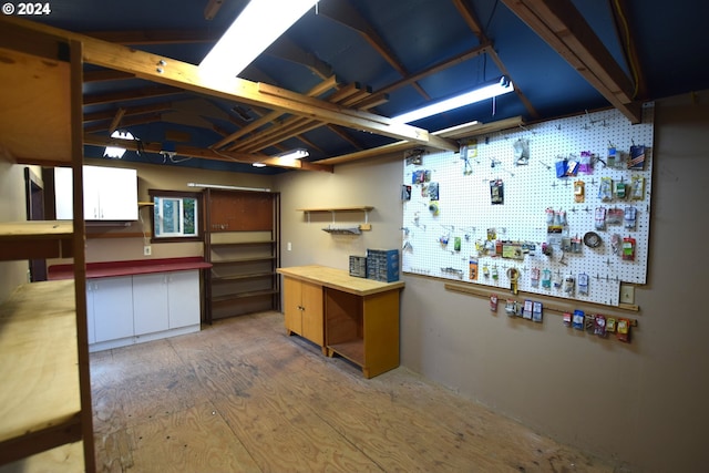 kitchen with lofted ceiling, butcher block counters, and wood-type flooring