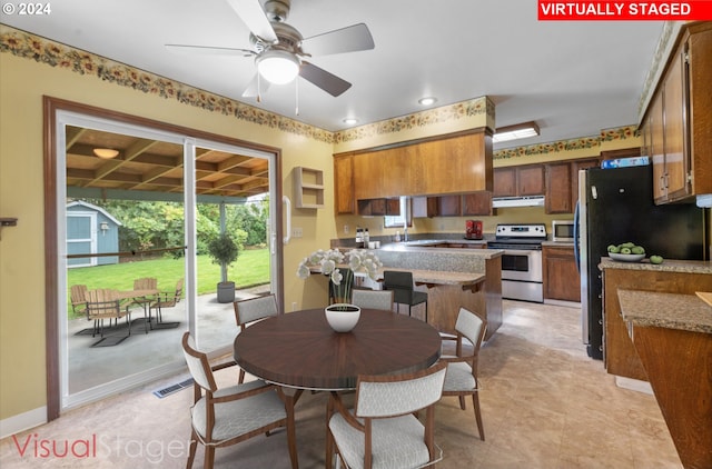 dining space with sink and ceiling fan