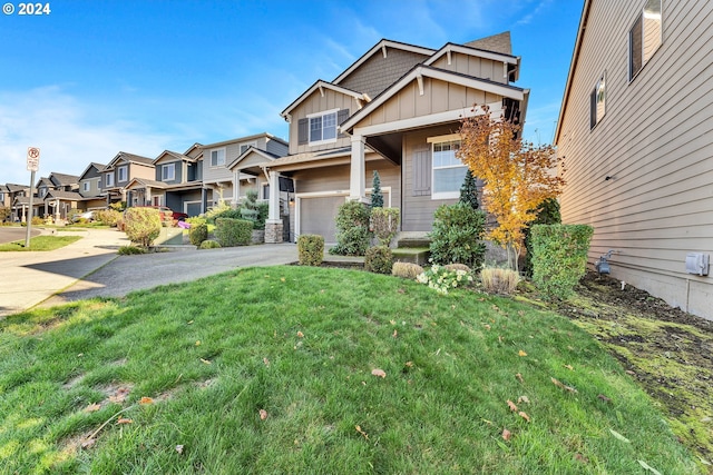 view of front of home with a garage and a front lawn