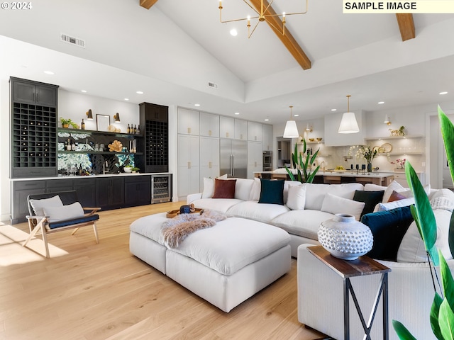 living room with high vaulted ceiling, beamed ceiling, wine cooler, and light hardwood / wood-style flooring