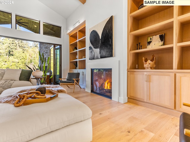 interior space featuring light wood-type flooring and lofted ceiling