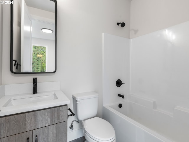 full bathroom with shower / bath combination, vanity, and toilet