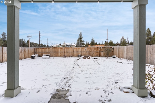 view of yard covered in snow